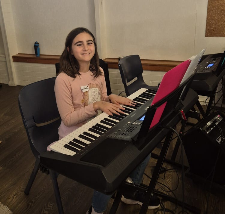 Student playing keyboard